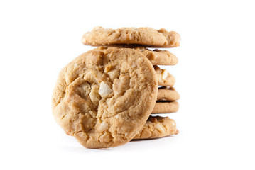 Stack of madamia nut cookies on a white isolated background