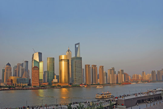 Shanghai Pudong riverfront buildings at sunset