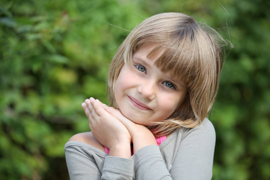 little girl on a greem background