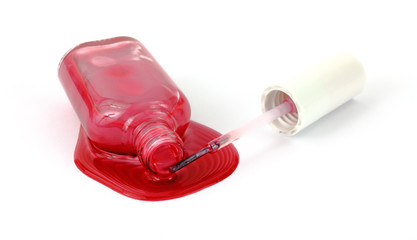 Spilled nail polish with applicator.
