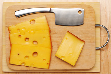 Swiss cheese and knife