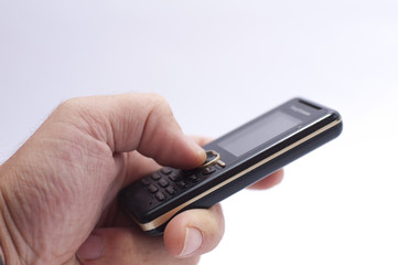 Hand holding a mobile phone isolated on white