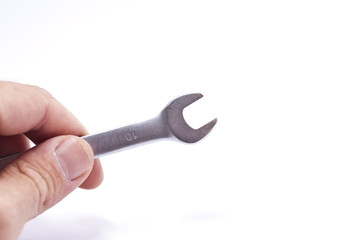 Hand holding a 10 key isolated on white