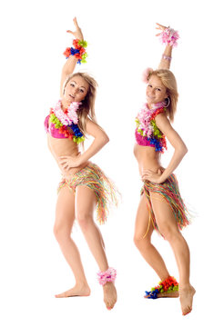 two beautiful dancers in hawaiian costumes isolated