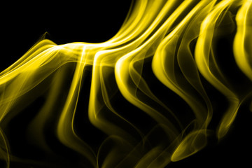 Yellow smoke in black background