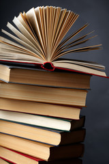 Pile of books on a black background