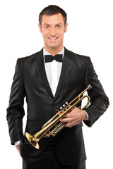 Fototapeta premium Young man in suit holding a trumpet