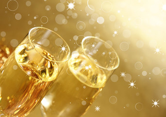 Champagne glasses on golden background