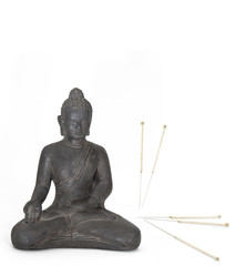 Akupunkturnadeln mit Buddha