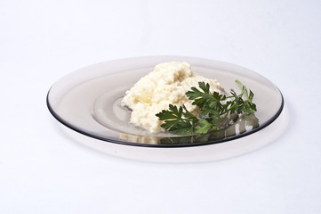 Egs and onion on a plate isolated on white background