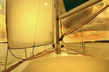 Yacht Under Sail in sunset