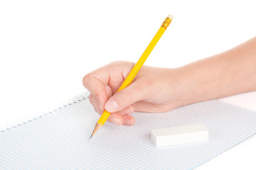 women hand with pencil and a notebook, isolated