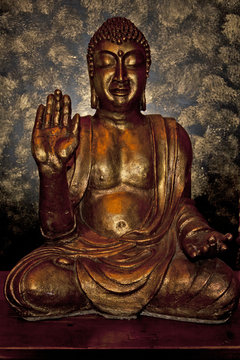Backlit golden buddha icon