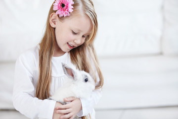 Little girl and white rabbit