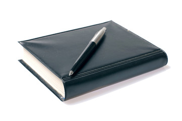 pen on organaizer isolated over white