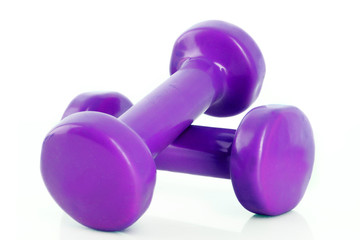 Couple of purple dumbbells isolated on white