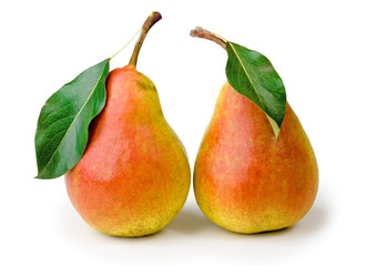 Ripe pears with leaves on white background