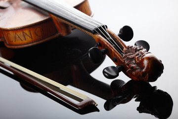 Violin and bow on dark background