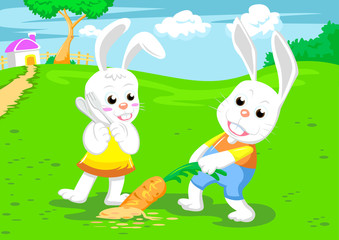 Fototapeta na wymiar couple rabbits and big carrot