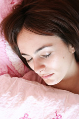Obraz na płótnie Canvas Beautiful young woman sleeping.