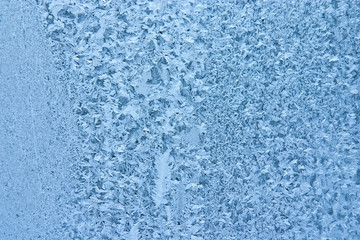 frost pattern on window glass - abstract winter background