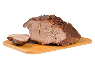 Roast beef on a wooden board