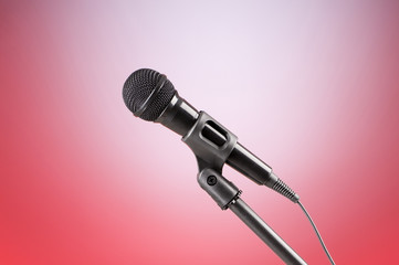 Black microphone against the colorful gradient background