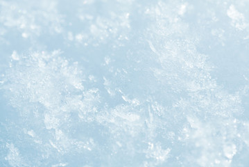Winter snowflakes on snow surface (macro)