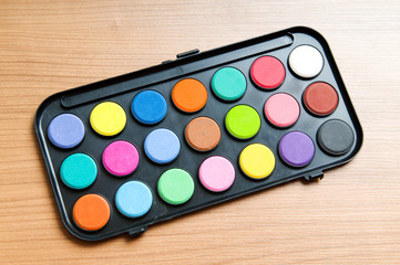 Art concept with painters palette and paint brush