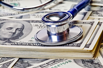 Stethoscope and dollars