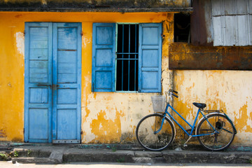 a bicycle and blue window