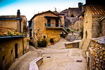 Colourful view of Italian town street with houses