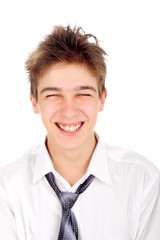 happy and laughing teenager isolated on the white