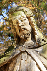 Obraz premium Ancient Jesus on a old Prague Cemetery