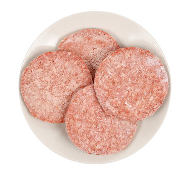 Frozen Hamburger Meat On Plate Isolated Over White