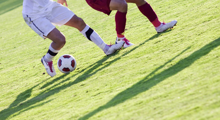 Fototapeta premium Soccer players running after the ball