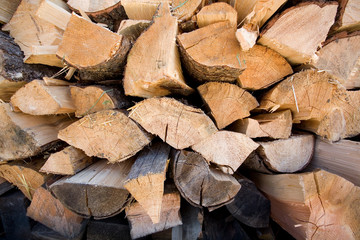 A tight stack of already cut and dried firewood.