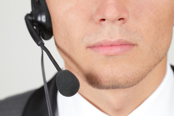 Closeup of operator's mouth and a microphone