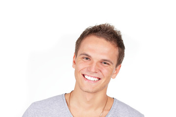 Handsome young man laughing. Isolated on white