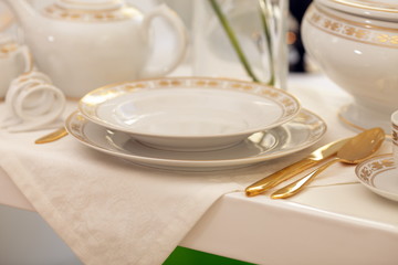 Set of fine gold porcelain dishware