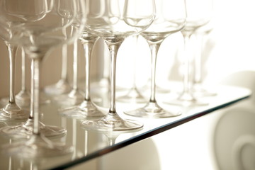 Lots of wine glasses on shelf