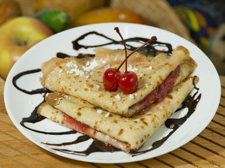 Strawberry Crepes with cherries on top
