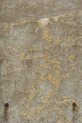 worn empty stone sign with rusty bolts