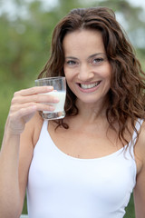 Closeup of beautiful woman drinking milk