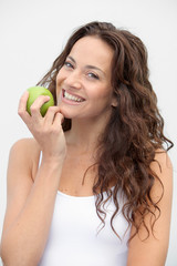 Closeup of woman eating a green apple