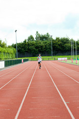 Athletic male sprinter training