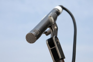 high resolution microphone on blue sky background