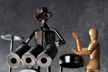 Two drummer figures playing percussion