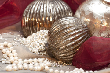 Christmas ornaments with glimmer on red background