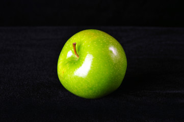 Green apple isolated, black background